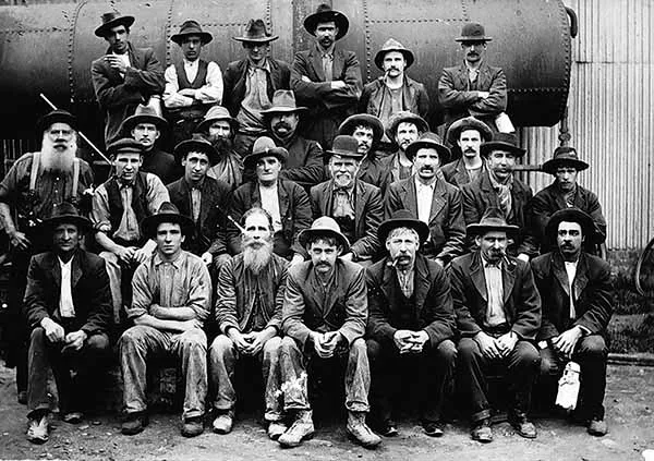 Historical photograph of workers — the kind of photo we restore
